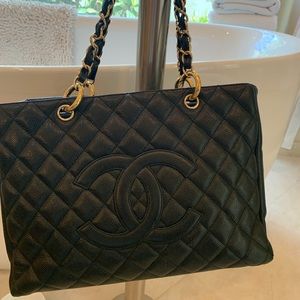 Chanel Black Caviar leather tote.          13”X10”  zip closure at top